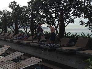 Lounge chairs around pool.