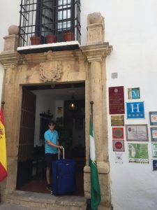 Mark with luggage at Hotel San Gabriel.