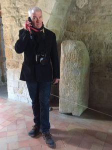 Mark beside an ancient Roman ‘Mile-Stone’.