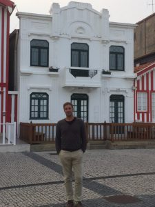 Miguel outside an Art Nouveau house.