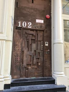 Squatters put this door together from bits of discarded junk. Now featured art in Soho