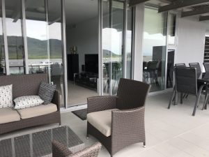 Room enough for a lounge and dining table under the covered part of balcony.