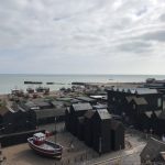 View over harbour and fishing net storage huts.