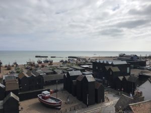 View over harbour and fishing net storage huts.